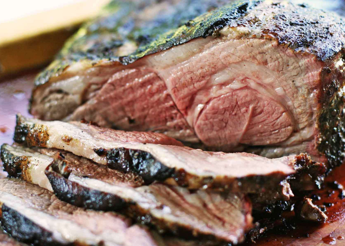 Beautiful Grill and Marinated Leg of Lamb Partially Sliced into Pieces